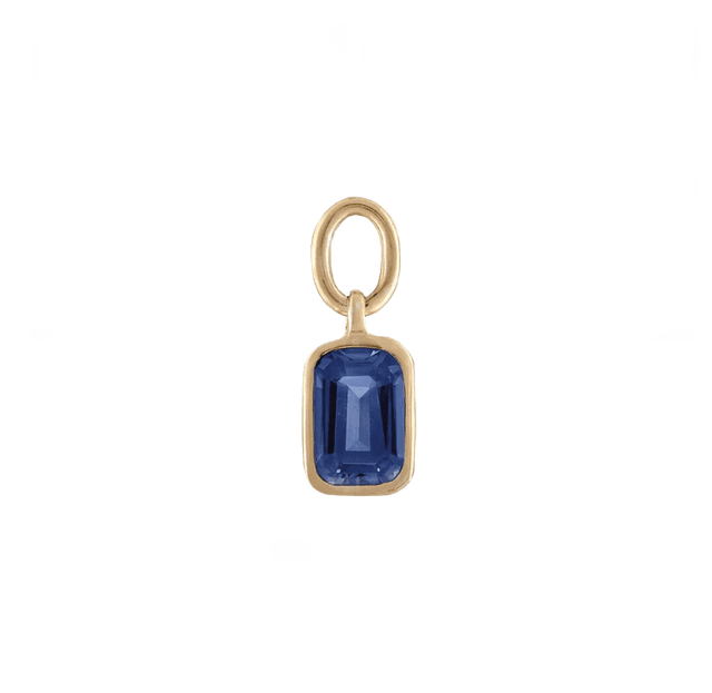 Blue gemstone charm bracelet emphasizing a collegiate seal.