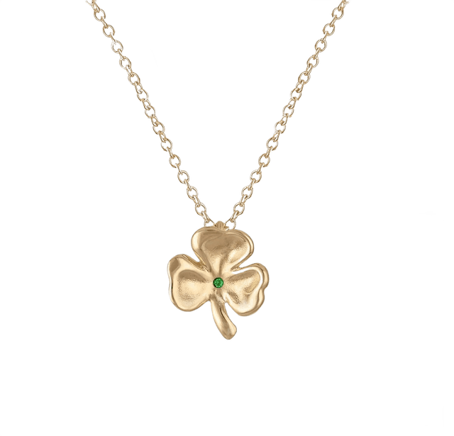 Gold clover necklace with a vibrant green clover charm.